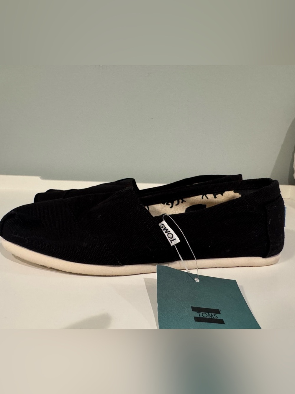 Toms Black Canvas Slip-On Flats with Off-White Sole